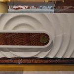 Sculptural Coffee Table with Integrated Marble-Effect Top, Natural Wood Veneer, and White Lacquer Accents